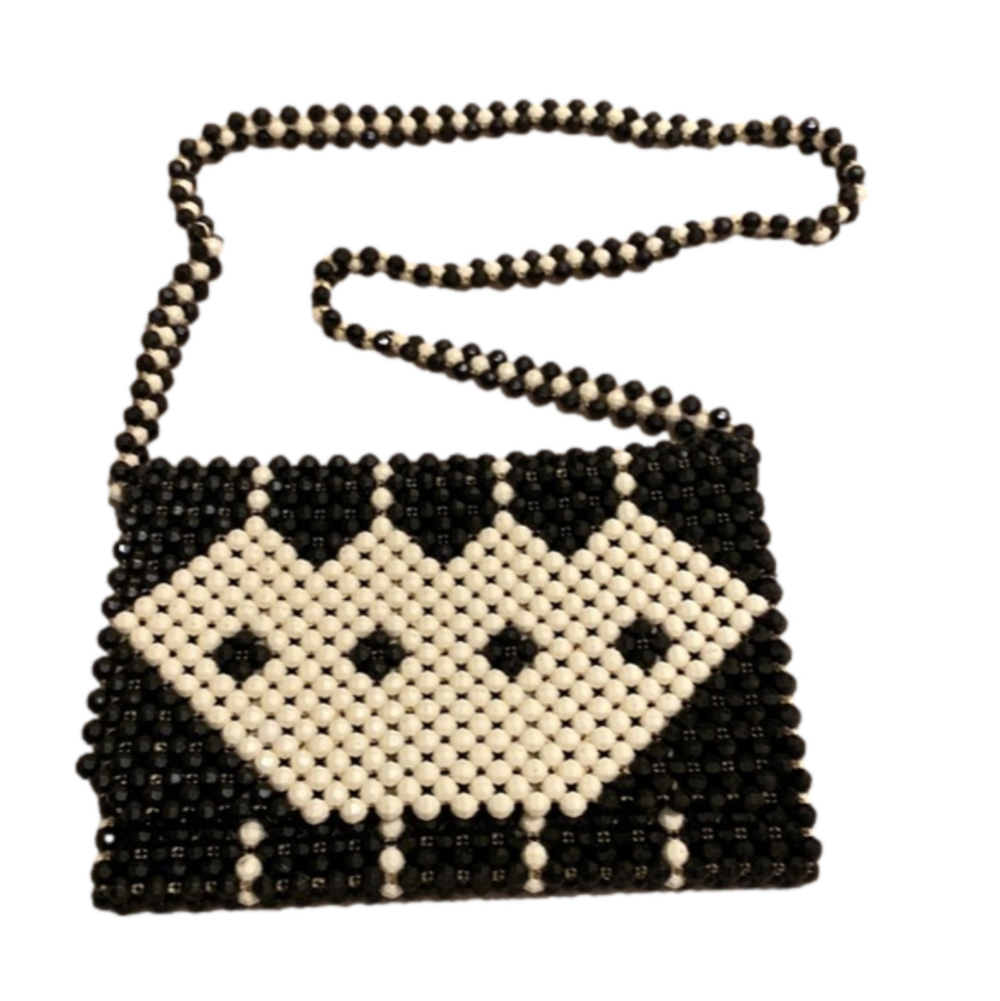 Black and white beaded shoulder beautiful bag .